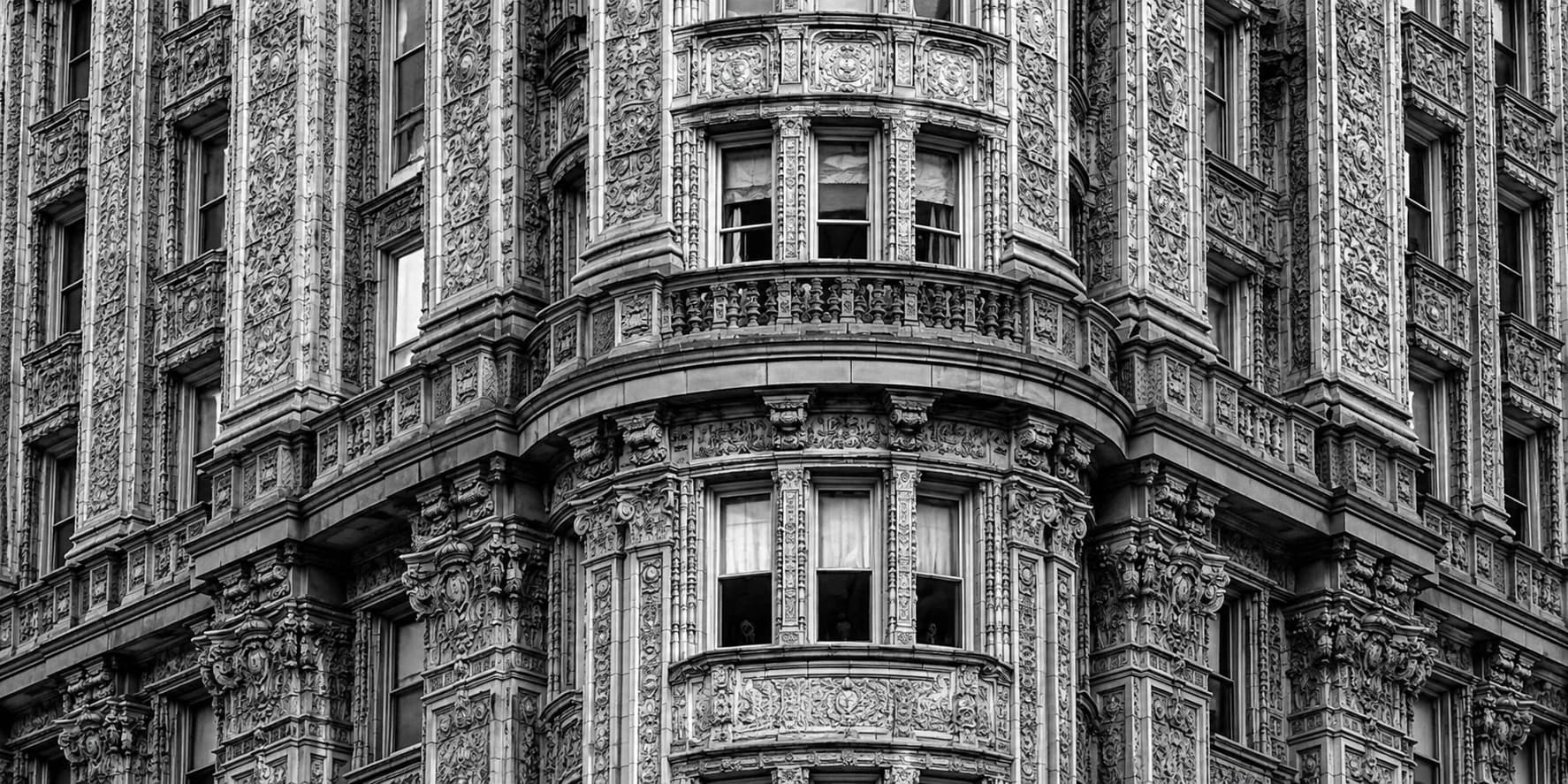 An ornate Beaux-Arts facade, window bays in a dense grid