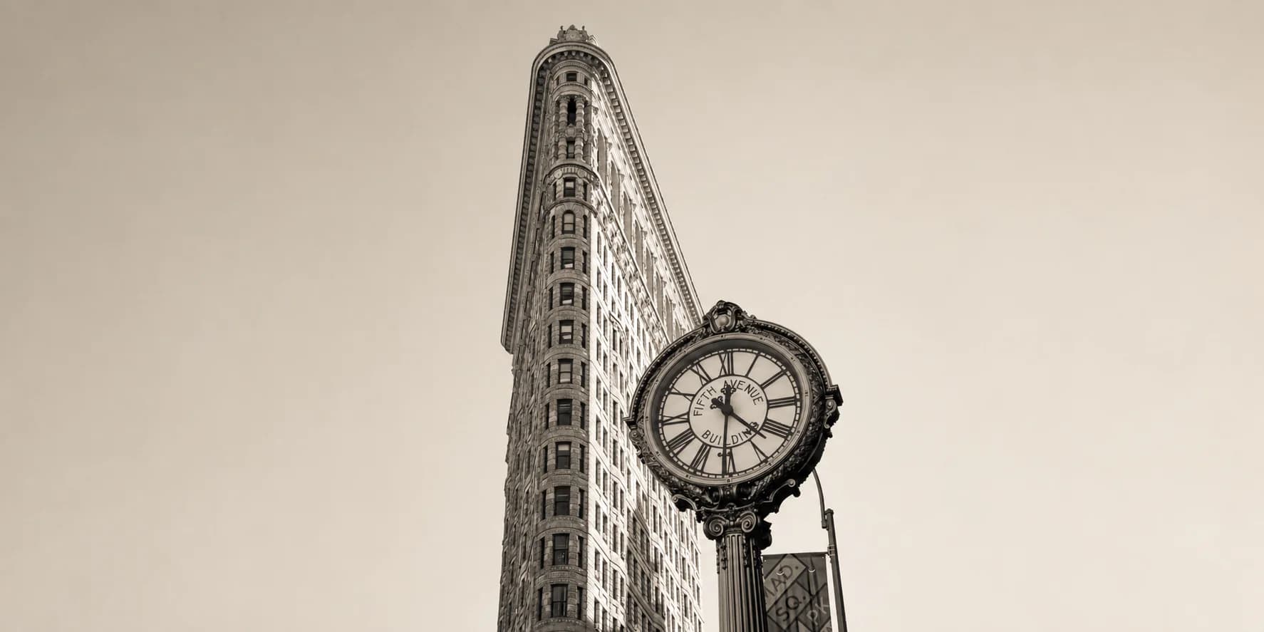 The Flatiron Building with the Fifth Avenue Building street clock
